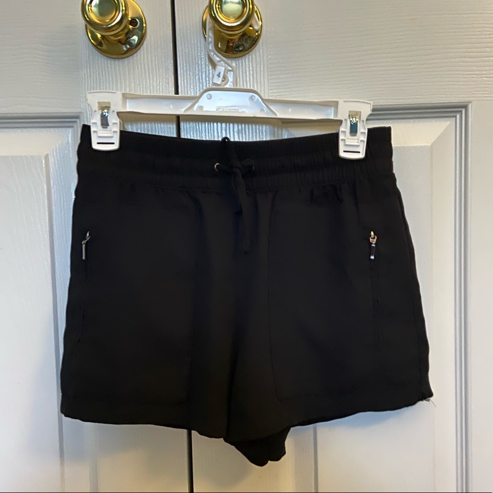 Black shorts with zipper pockets and drawstring